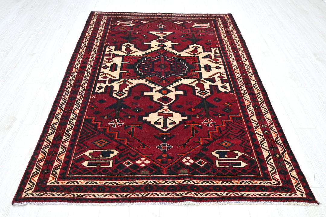 red Medium rug 5' 4" x 7' 10"