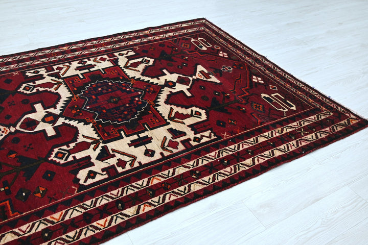 red Medium rug 5' 4" x 7' 10"