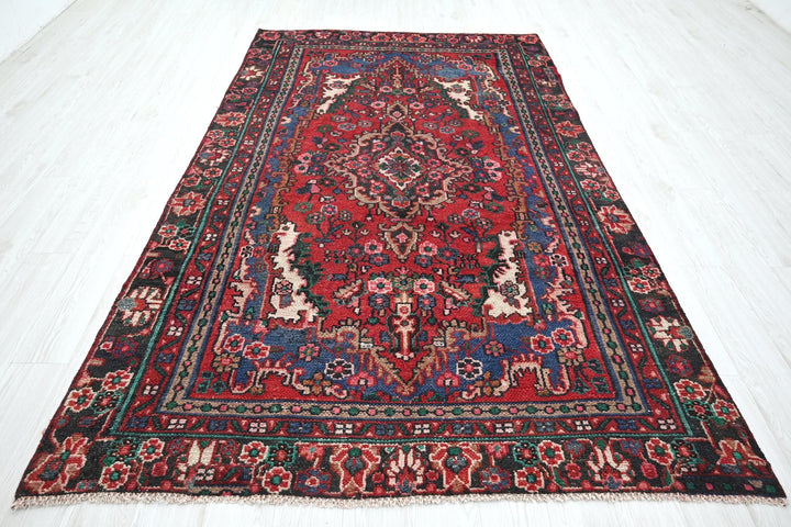 red Medium rug 5' 5" x 9' 4"
