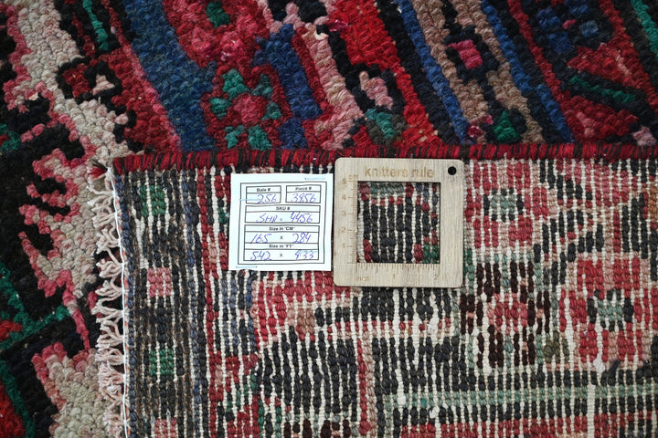 red Medium rug 5' 5" x 9' 4"