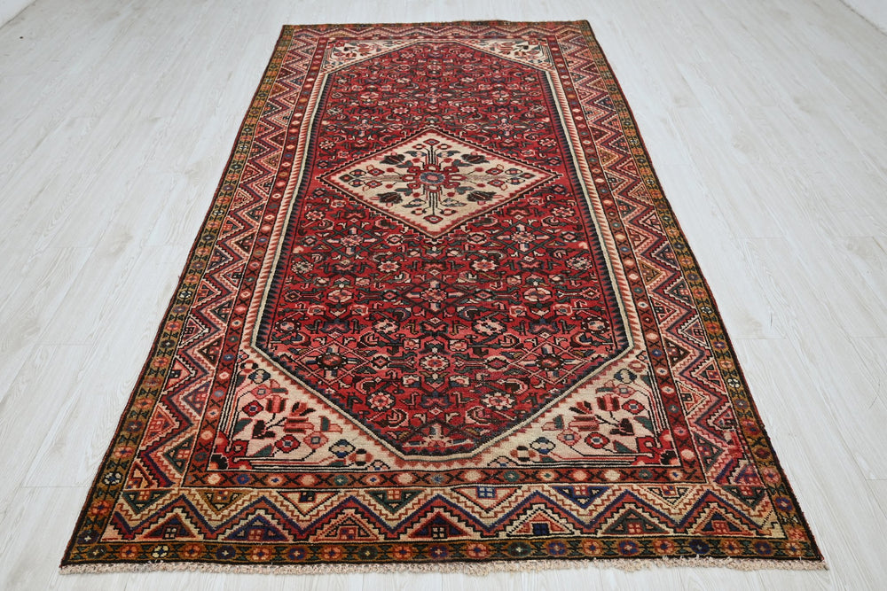 red Large rug 5' 0" x 9' 11"