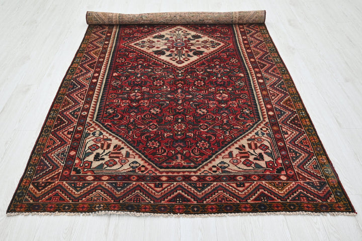 red Large rug 5' 0" x 9' 11"