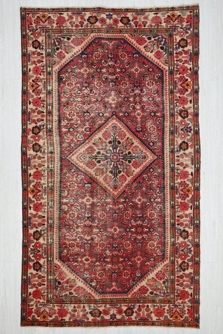 red Large rug 5' 5" x 10' 5"