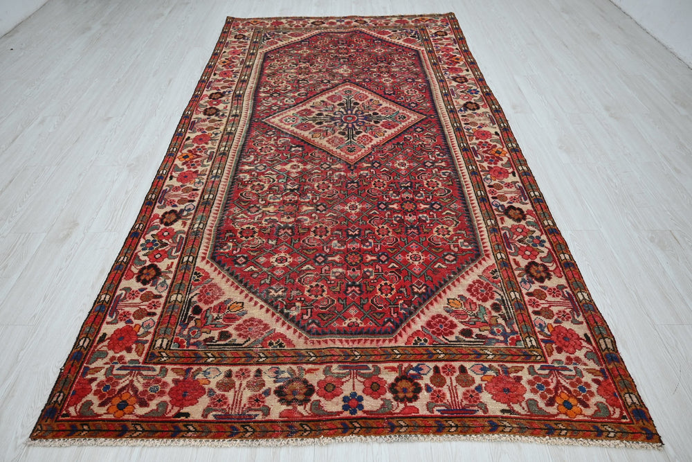 red Large rug 5' 5" x 10' 5"