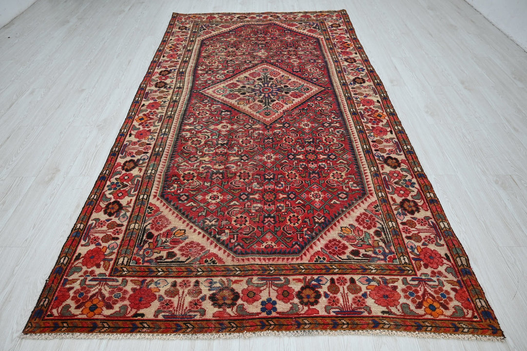 red Large rug 5' 5" x 10' 5"