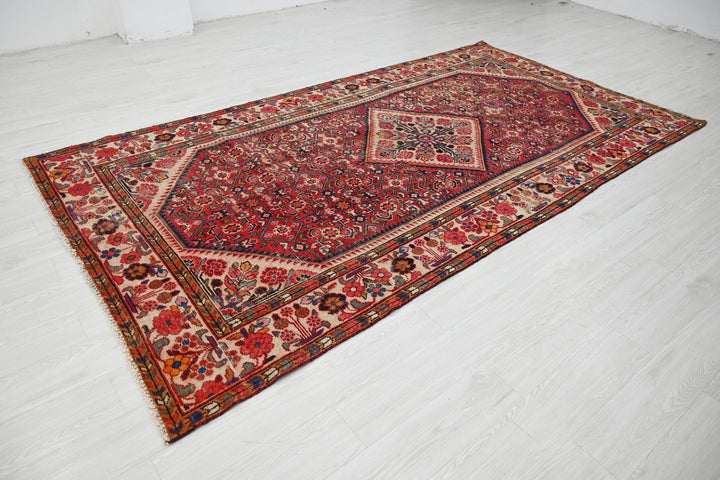 red Large rug 5' 5" x 10' 5"