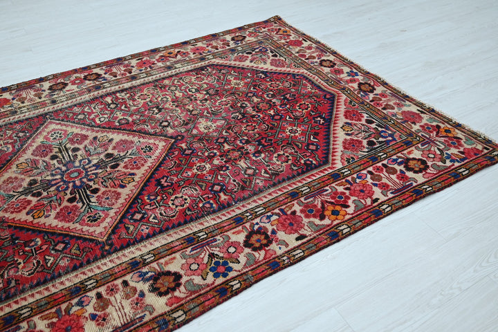 red Large rug 5' 5" x 10' 5"