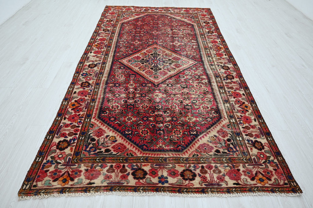 red Large rug 5' 5" x 10' 5"