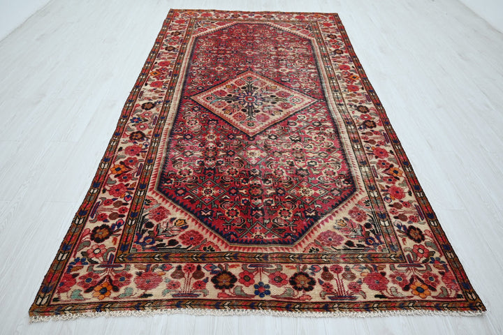 red Large rug 5' 5" x 10' 5"