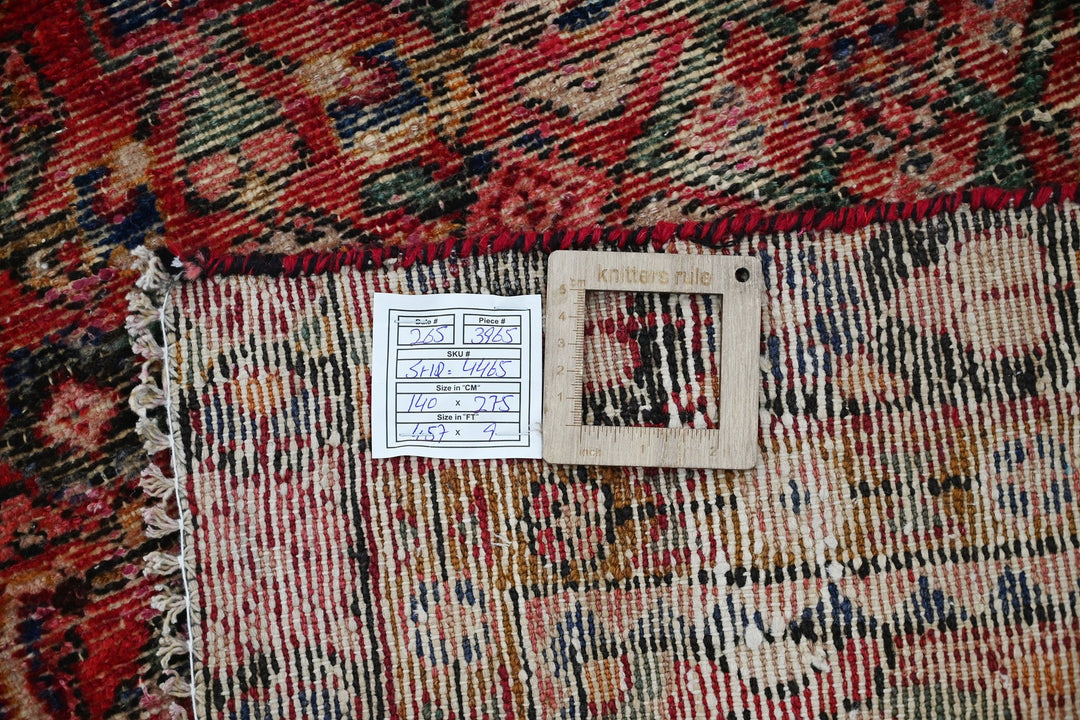 red Medium rug 4' 7" x 9' 0"