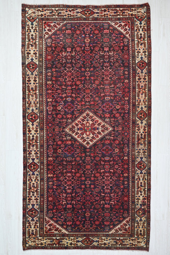 red Large rug 5' 2" x 10' 10"