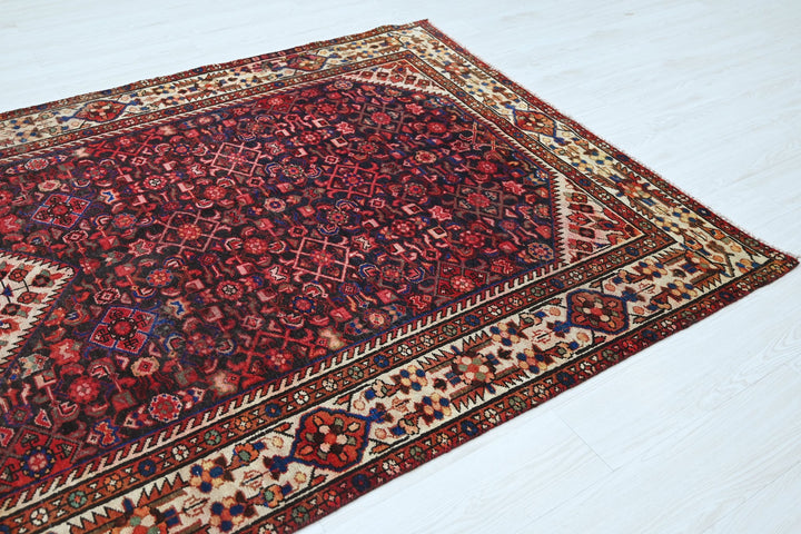 red Large rug 5' 2" x 10' 10"