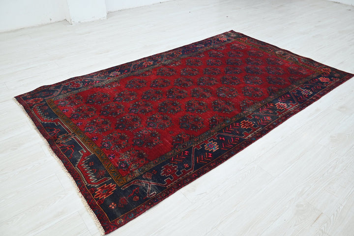 red Medium rug 4' 9" x 8' 1"