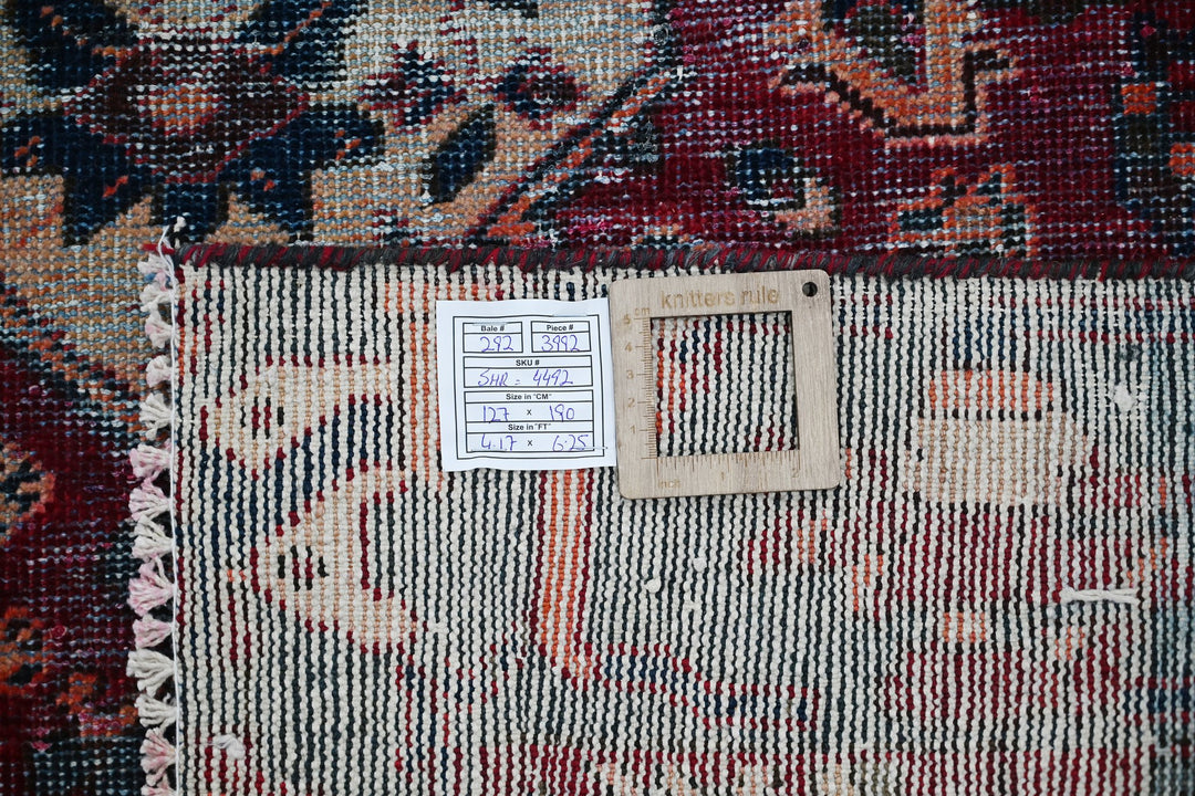 red Accent rug 4' 2" x 6' 3"