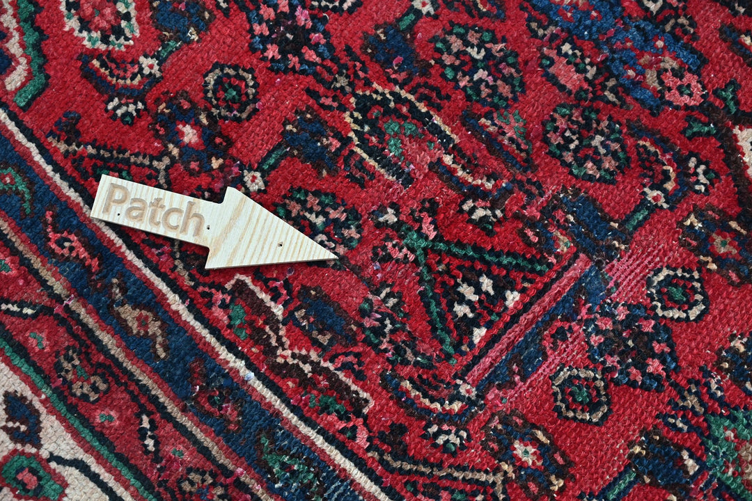 red Large rug 6' 11" x 9' 3"