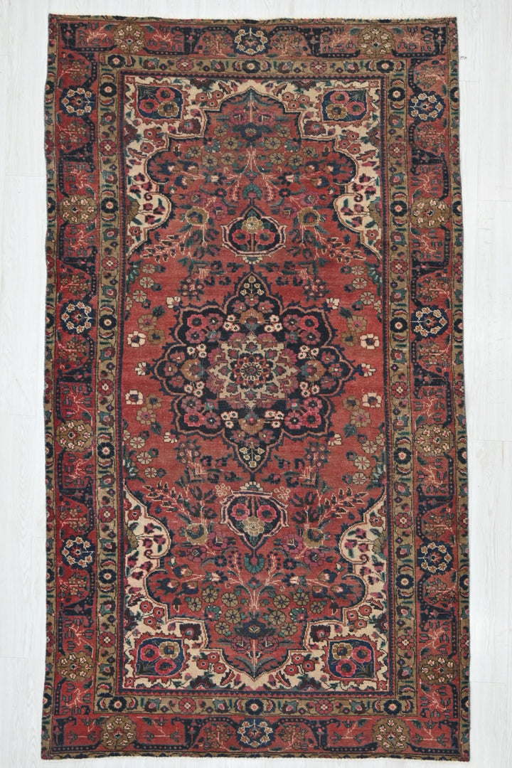 red Medium rug 5' 3" x 9' 1"
