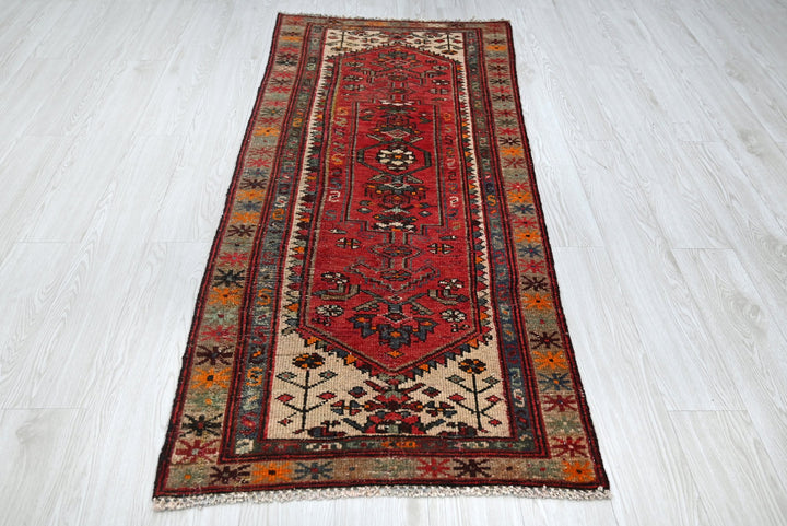 red Accent rug 2' 7" x 6' 0"