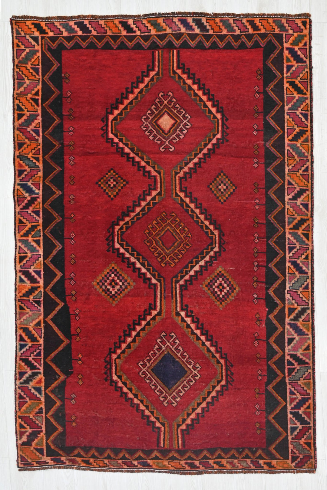 red Medium rug 4' 8" x 7' 9"
