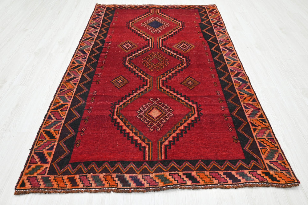 red Medium rug 4' 8" x 7' 9"