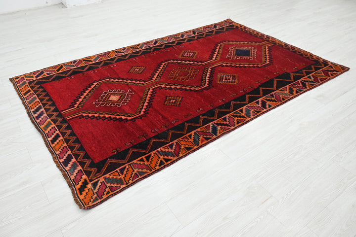 red Medium rug 4' 8" x 7' 9"