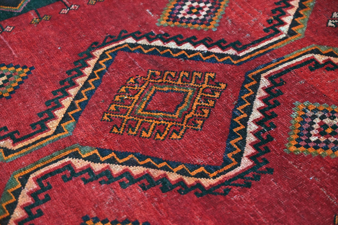 red Medium rug 4' 8" x 7' 9"