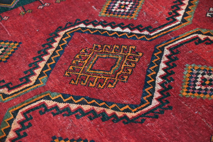 red Medium rug 4' 8" x 7' 9"