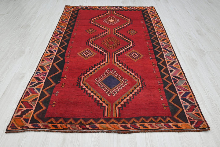 red Medium rug 4' 8" x 7' 9"