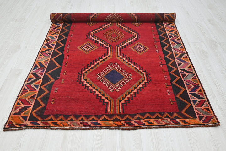 red Medium rug 4' 8" x 7' 9"