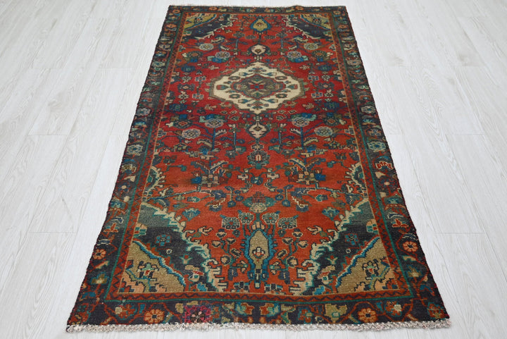 red Accent rug 3' 0" x 5' 10"