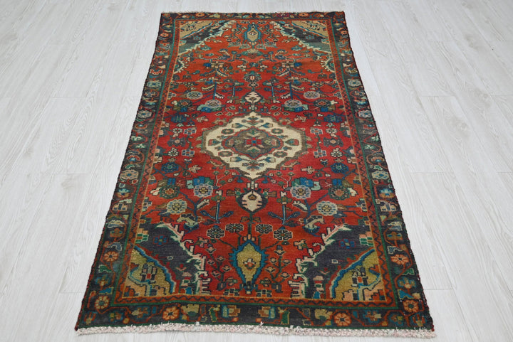 red Accent rug 3' 0" x 5' 10"