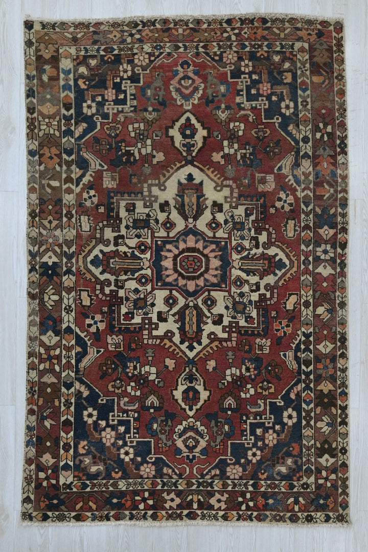red Medium rug 4' 7" x 7' 2"
