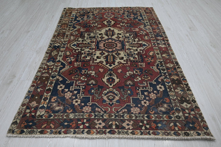 red Medium rug 4' 7" x 7' 2"