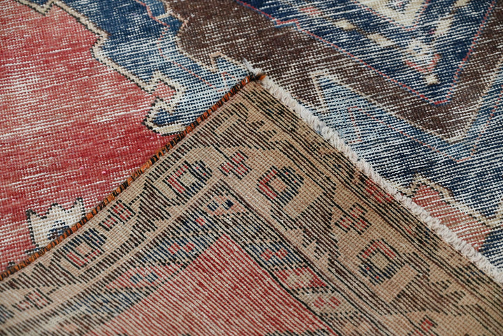 red Medium rug 4' 9" x 6' 10"