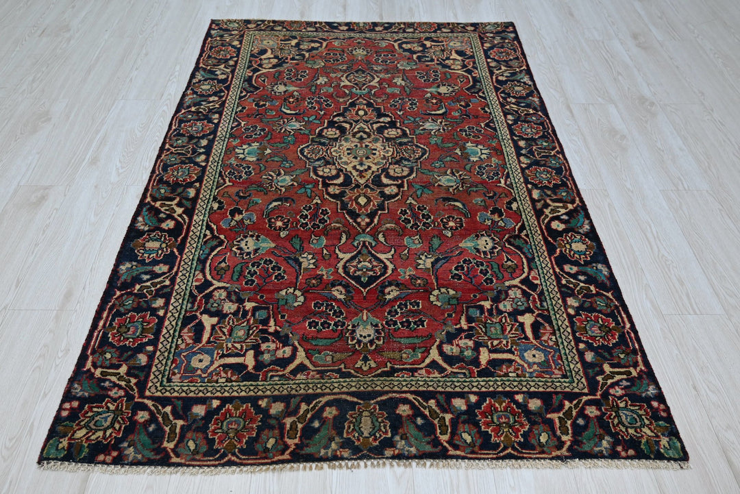 red Accent rug 4' 0" x 6' 2"