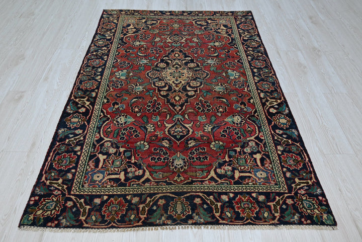 red Accent rug 4' 0" x 6' 2"