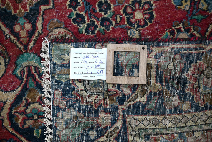 red Accent rug 4' 0" x 6' 2"