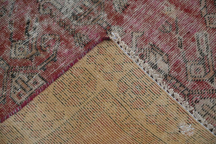 red Accent rug 3' 7" x 3' 10"