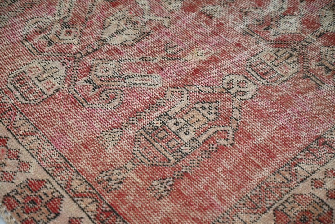 red Accent rug 3' 7" x 3' 10"