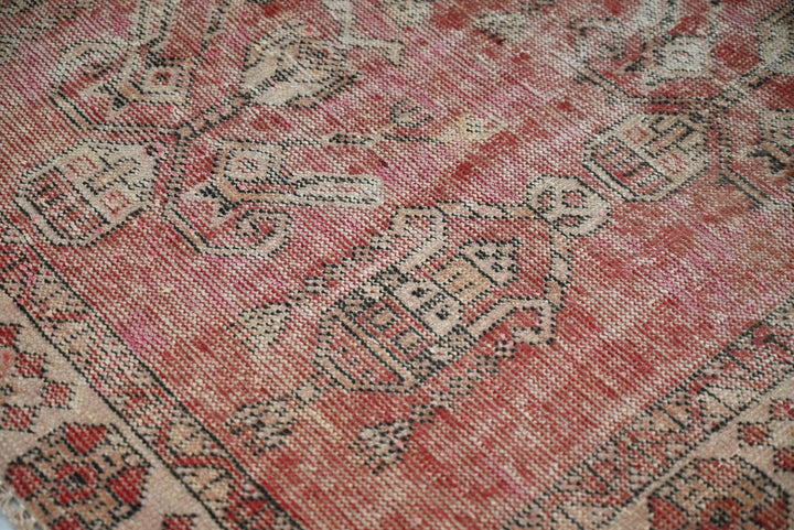 red Accent rug 3' 7" x 3' 10"