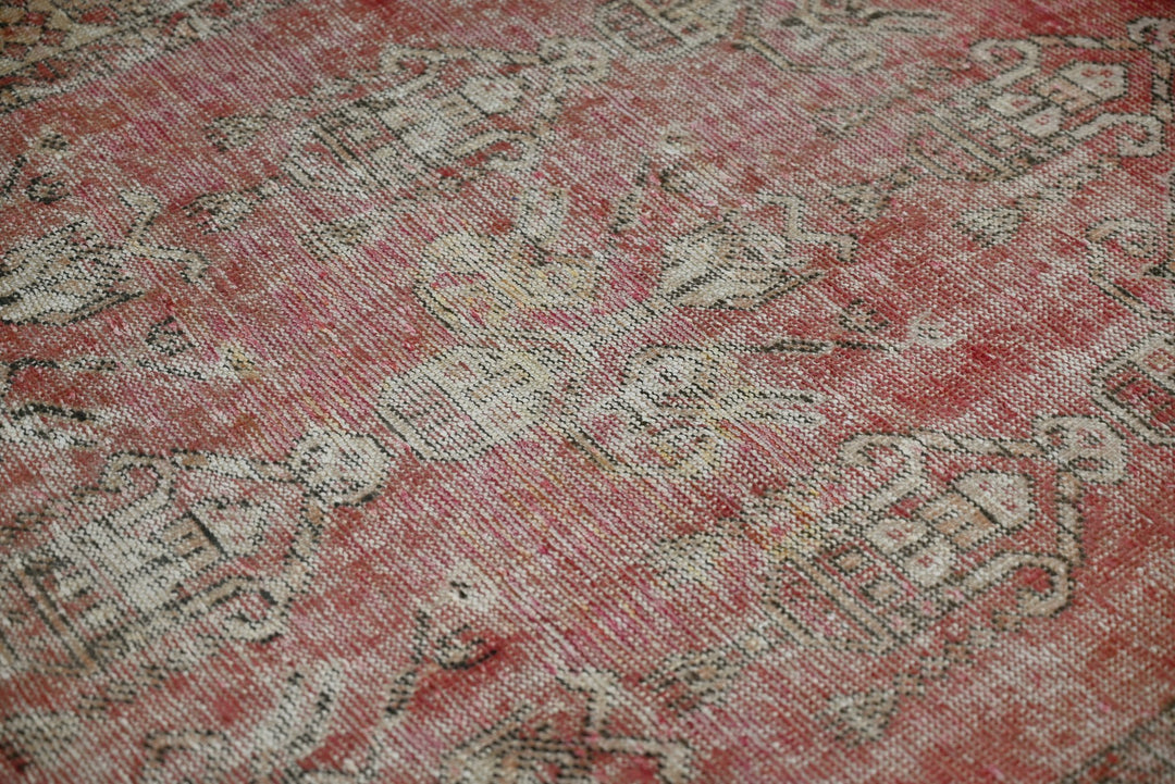 red Accent rug 3' 7" x 3' 10"