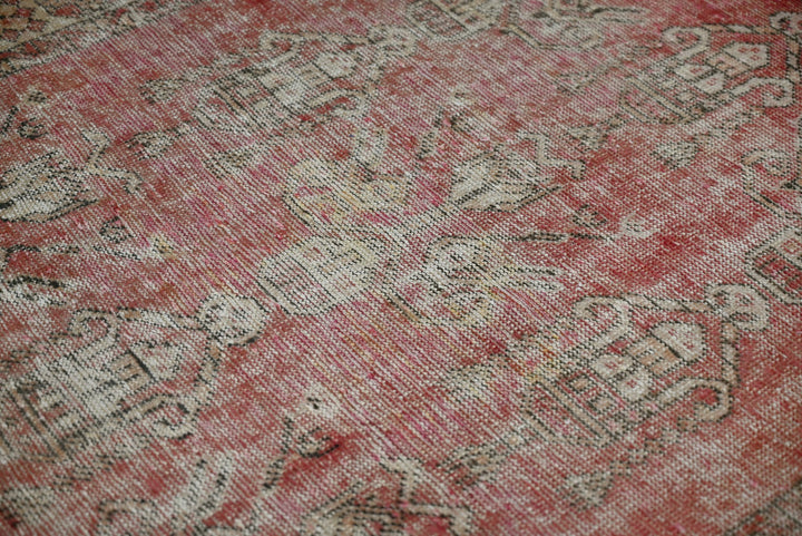 red Accent rug 3' 7" x 3' 10"