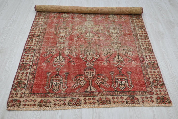 red Accent rug 3' 7" x 3' 10"