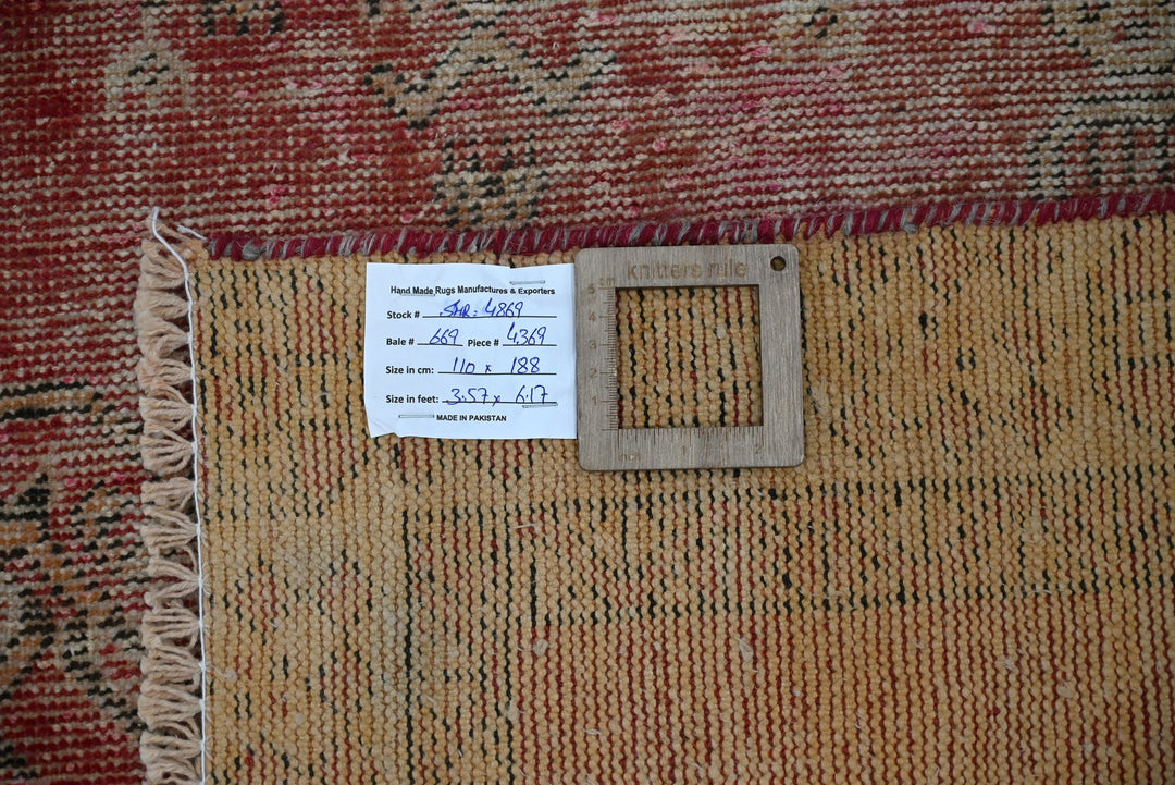 red Accent rug 3' 7" x 3' 10"