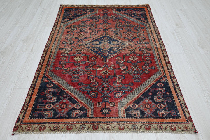 red Accent rug 4' 0" x 5' 11"