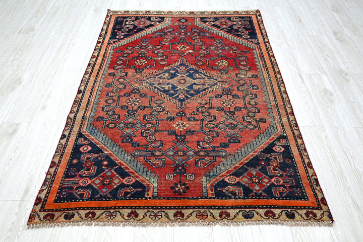 red Accent rug 4' 0" x 5' 11"
