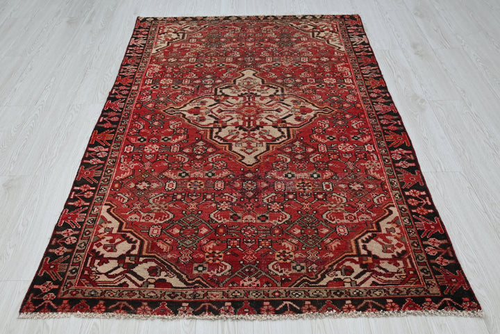 red Accent rug 4' 0" x 6' 3"