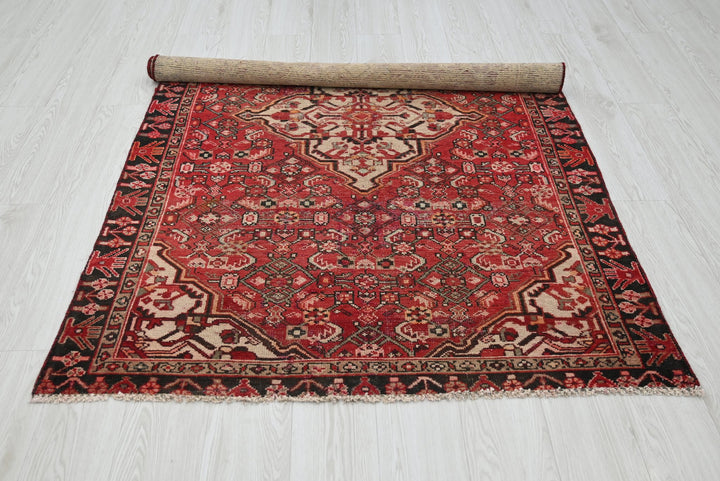 red Accent rug 4' 0" x 6' 3"