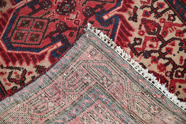 red Accent rug 2' 8" x 4' 1"