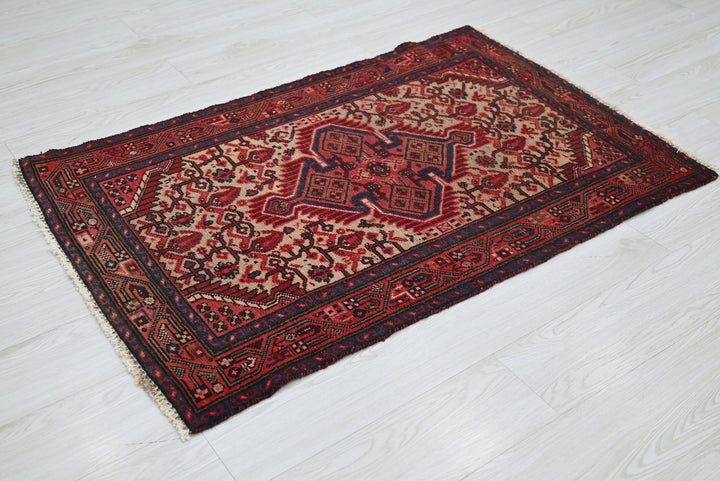 red Accent rug 2' 8" x 4' 1"