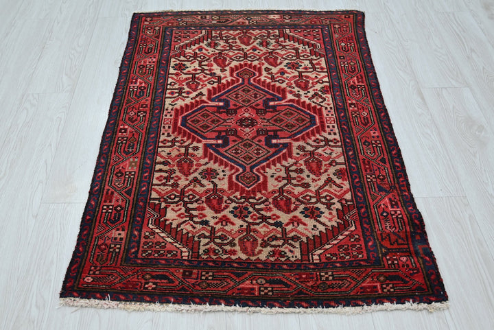 red Accent rug 2' 8" x 4' 1"